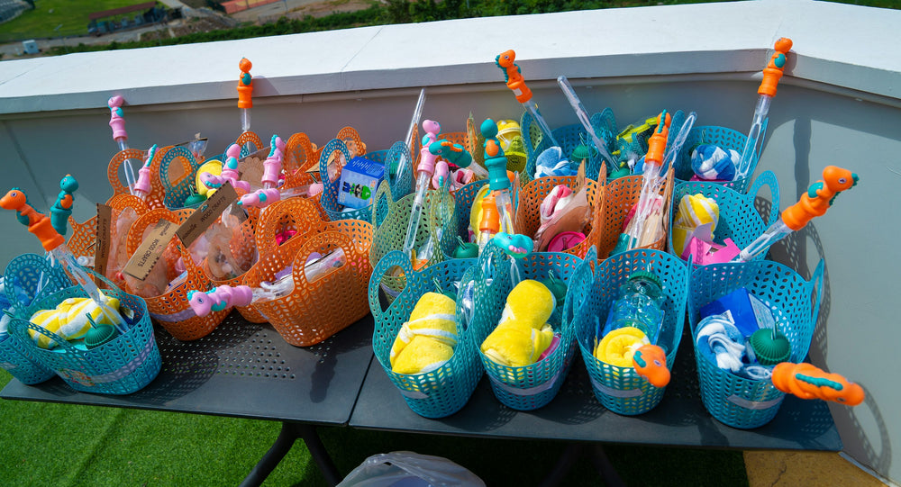 Party activity baskets with towels and bubble wands arranged for a children’s celebration