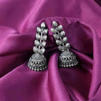 Oxidised silver jhumka drop earrings with leaf motifs and tiered bell design