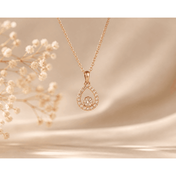 Rose gold teardrop crystal pendant necklace with circular halo and