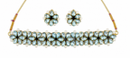 Kundan necklace set with blue teardrop stones and pearl beads, plus matching earrings