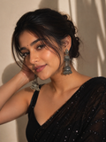 Oxidized silver-tone jhumka drop earrings with tiered bell and bead details