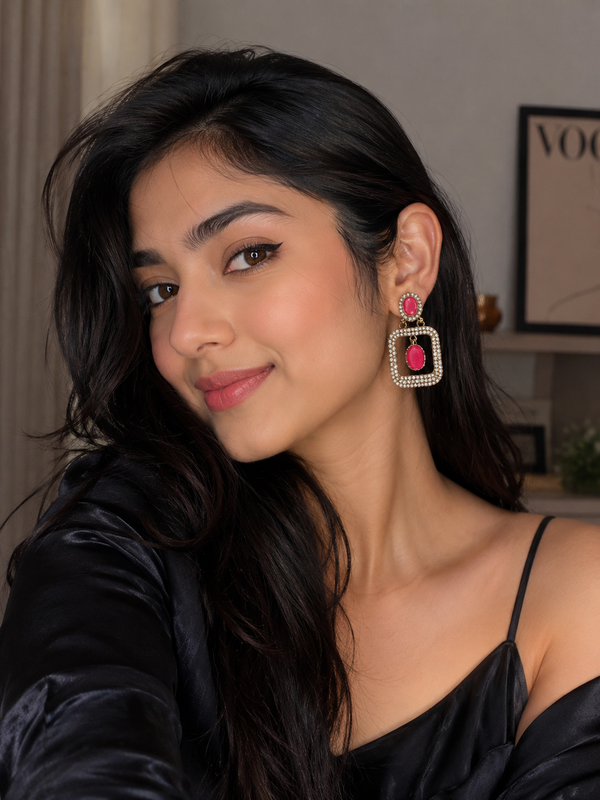 Pink geometric drop earrings with oval crystal stones and gold-tone frames
