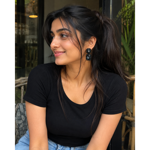Black Crystal Hand-Beaded Drop Earrings for Women - Black crystal drop earrings worn by a woman with a black top