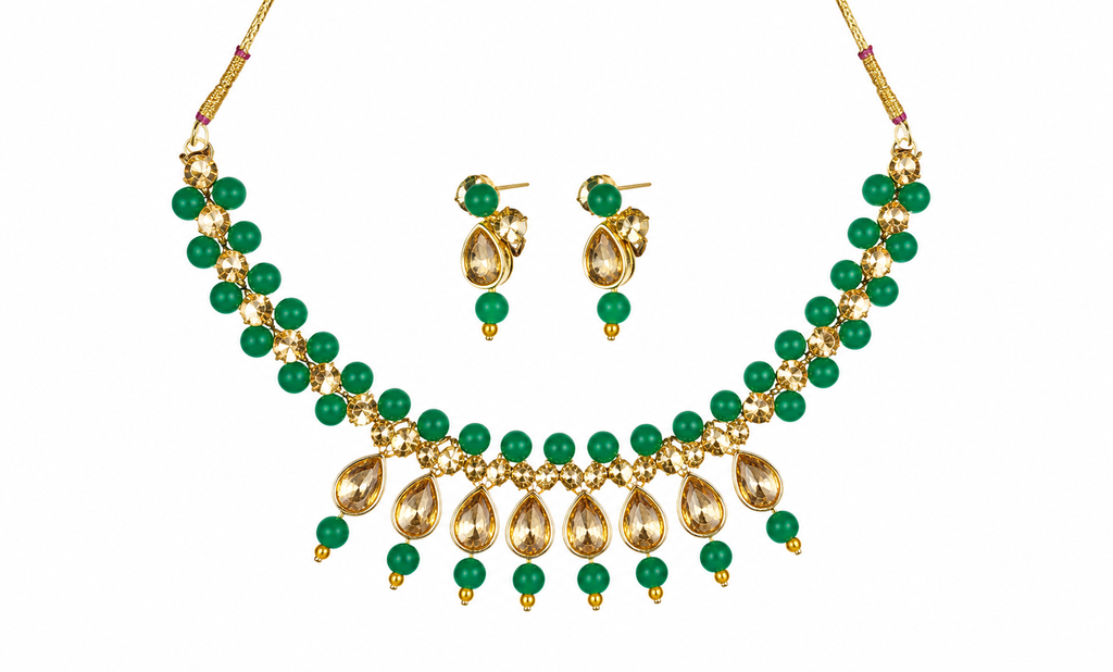Green bead and gold-tone kundan necklace with teardrop pendant and matching drop earrings