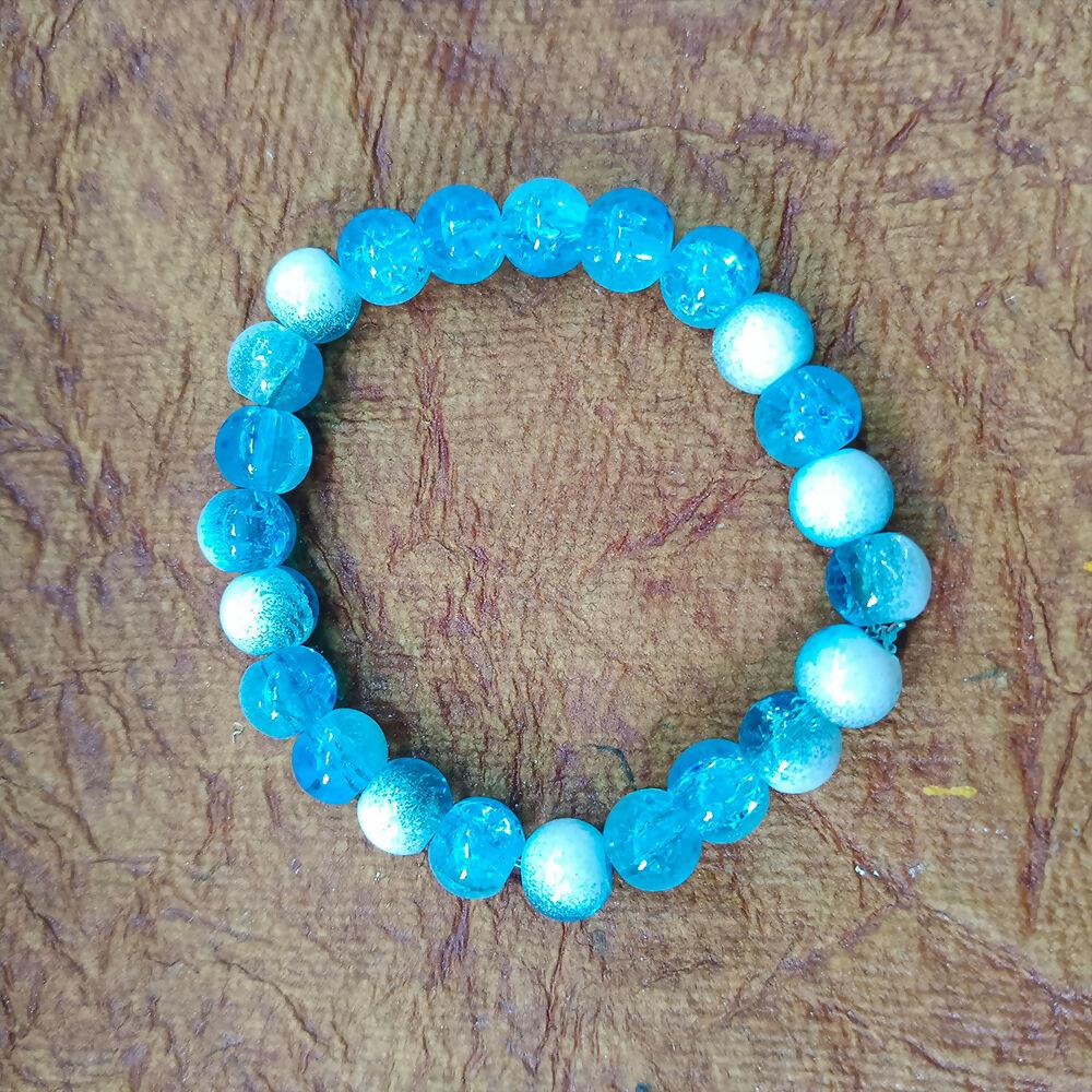 Ocean blue beaded bracelet by Couturier Design, unisex stretchable crystal style wrist band with polished beads.