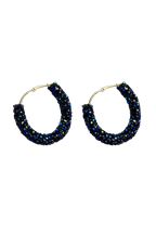 Blue crystal hoop earrings, gold-tone metal with textured bezel
