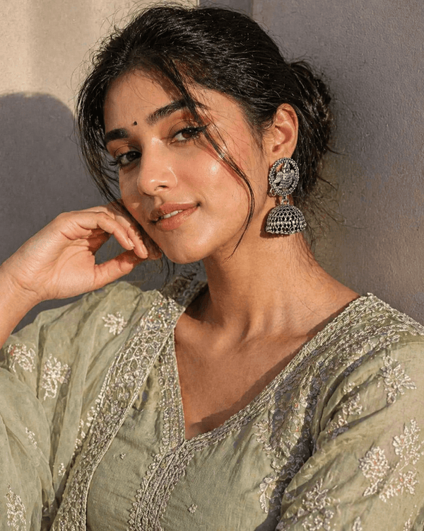 Oxidised silver peacock jhumka earrings with intricate traditional design, showcasing ethnic statement jewelry for women.