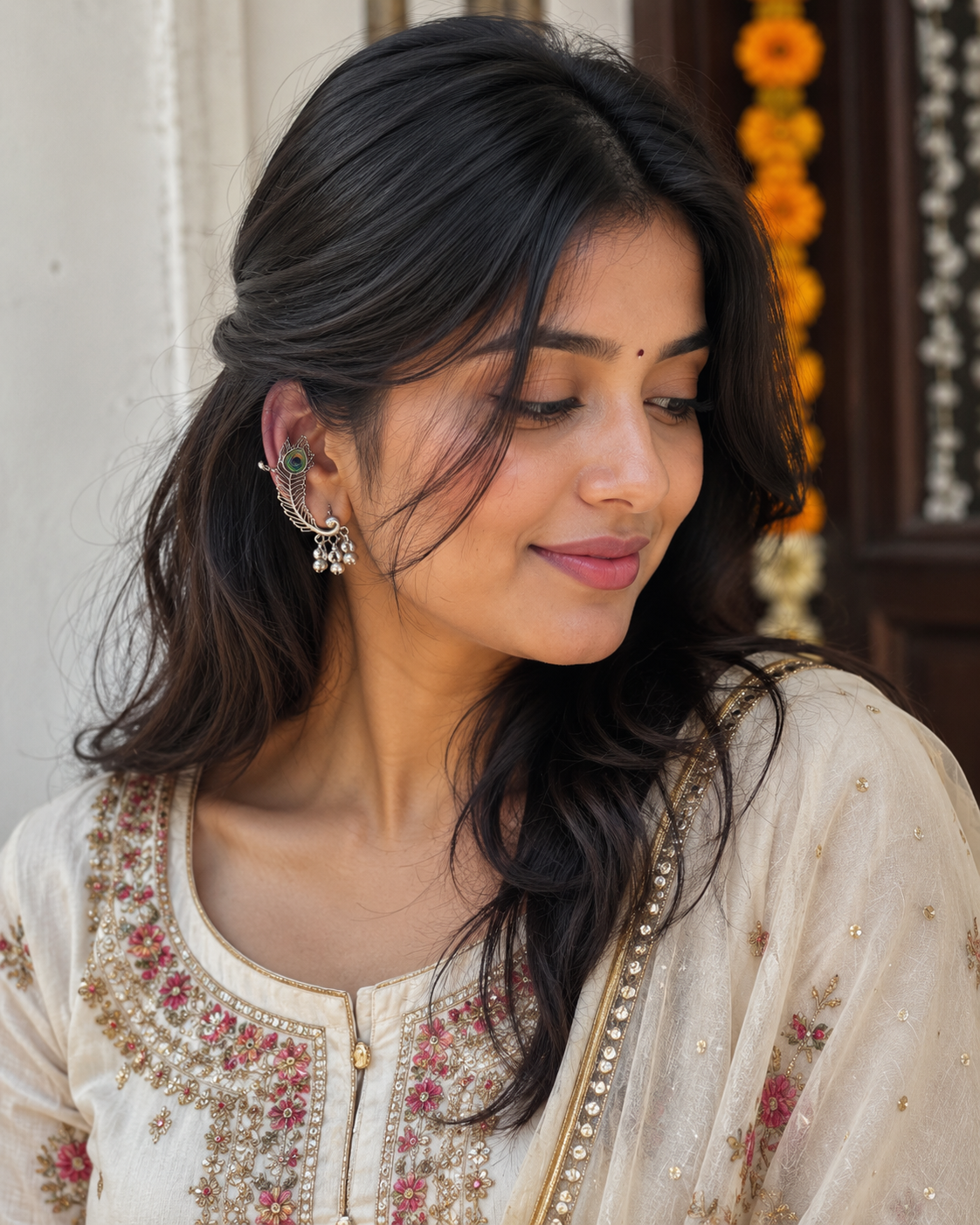 Oxidized silver peacock ear cuff earring with green eye and dangling silver details