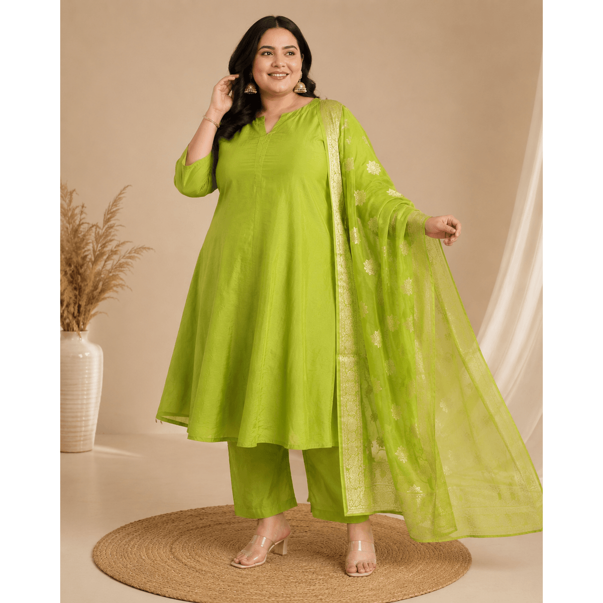 Lime green plus-size kurta set with matching pants and sheer organza dupatta with gold motifs
