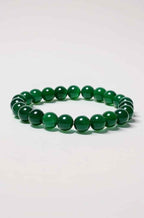 Green onyx beaded stretch bracelet with dark green round beads