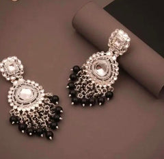 Close-up of oxidized silver Chandbali earrings with black bead drops