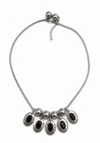 Silver-tone chain necklace with black oval stone drops and bead accents
