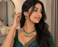 Green beaded kundan necklace with matching drop earrings on gold-tone setting