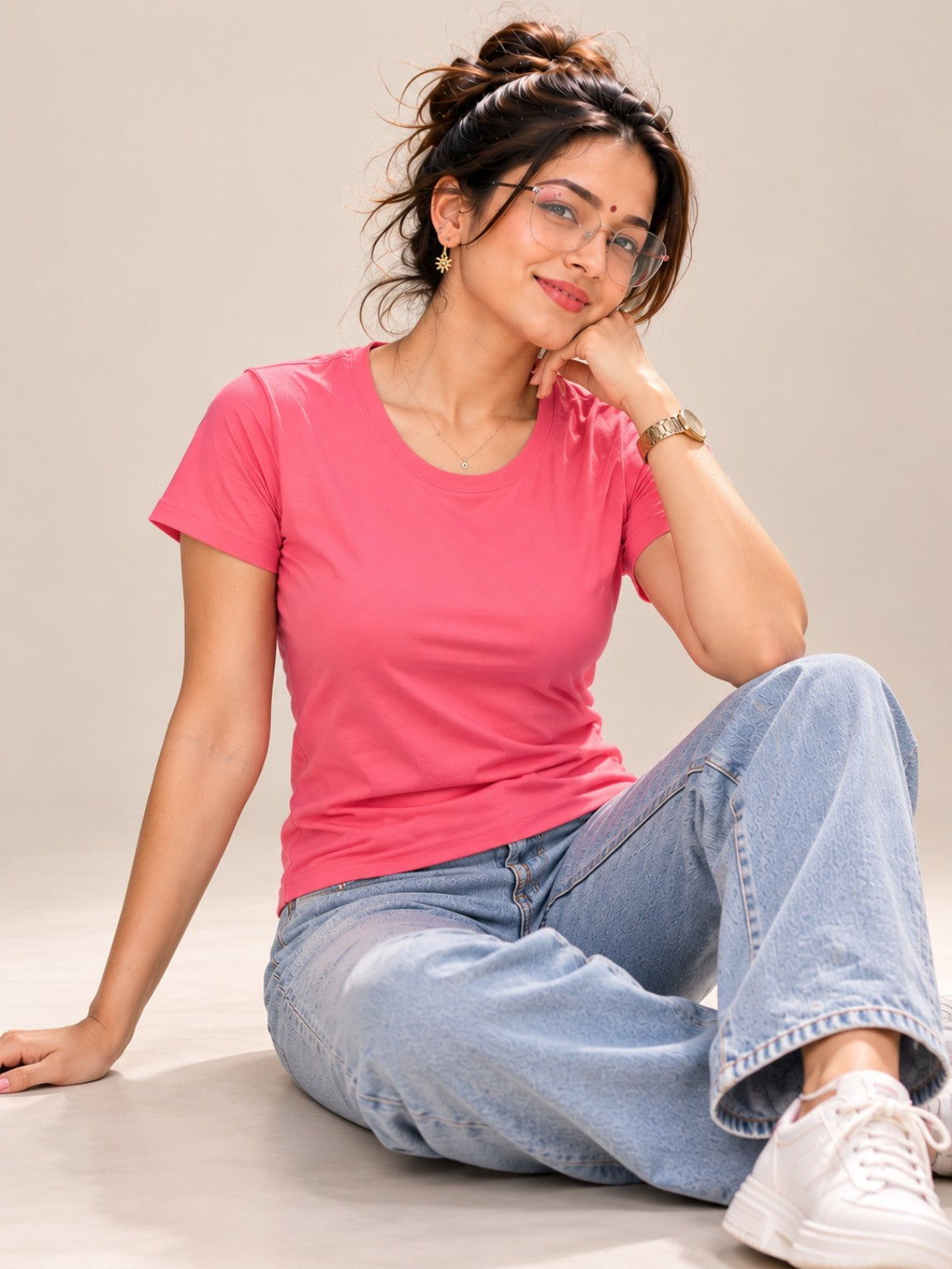 Women's pink slim fit round neck T-shirt studio seated pose