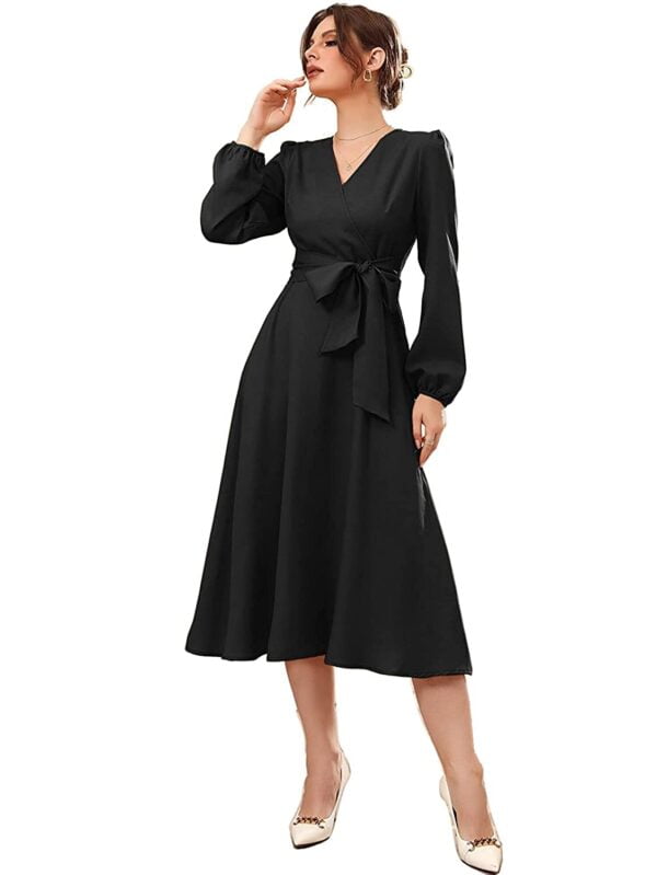 A woman wearing a Women Solid Belted Wrap Dress.