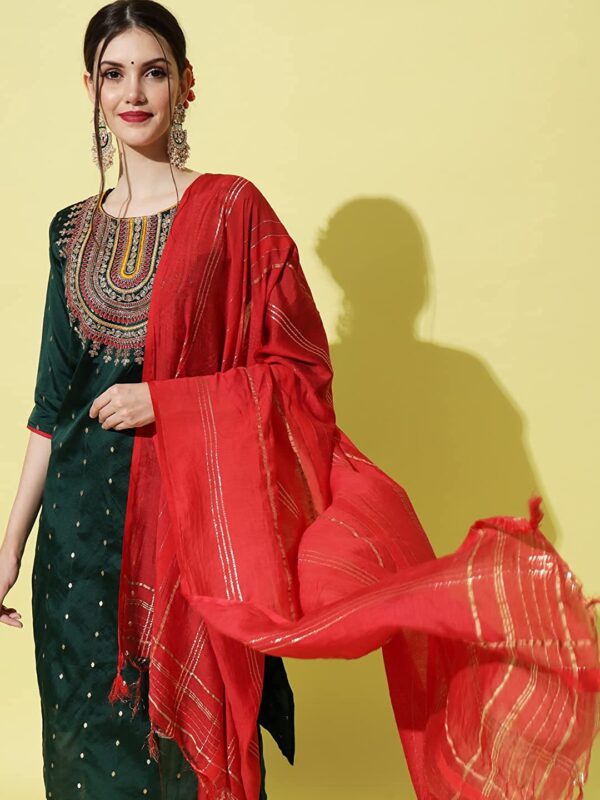 A woman donning a Silk Blend Embroidered Straight Kurta & Trousers Pant with Dupatta suit, paired elegantly with a red dupatta.