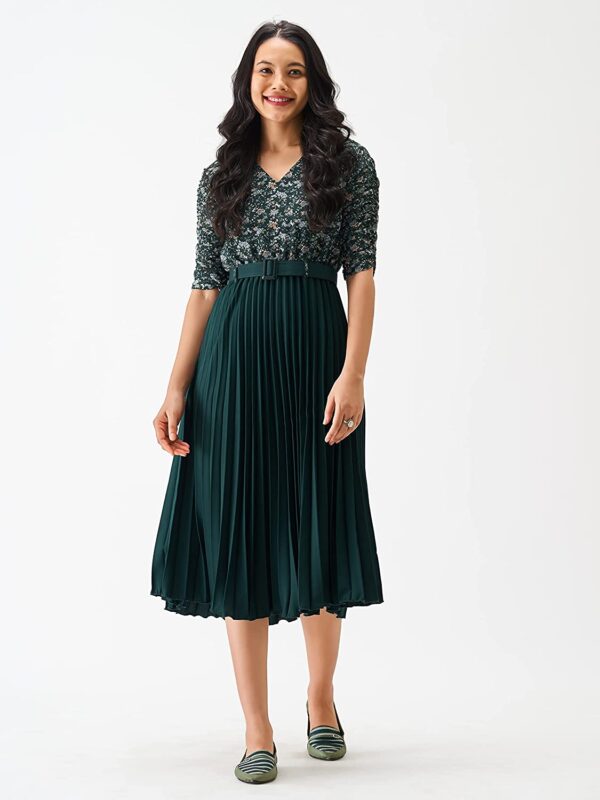 A woman wearing a green Women A-Line Maxi Dress set.