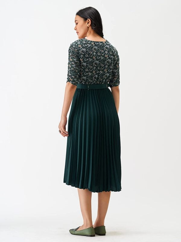 The back view of a woman wearing a green Women A-Line Maxi Dress set.