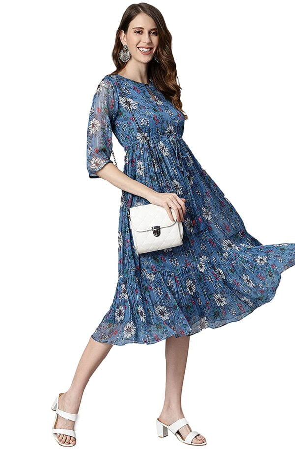 A woman wearing a Blue Poly Georgette Floral Flared Western Dress.